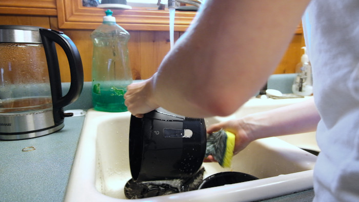 Cleaning the hopper in the sink